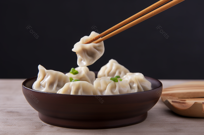 黑色的盘子里放置着一盘饺子背景图,高清,摄影图,摄影图片,图片大全,摄影图免费下载